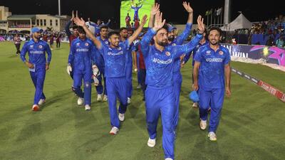 **EDS: IMAGE VIA @ICC** Kingstown: Afghanistan's captain Rashid Khan with teammates acknowledges fans after Afghanistan won the ICC Men's T20 World Cup cricket match against Bangladesh, at Arnos Vale Ground, Kingstown, Saint Vincent and the Grenadines, Monday, June 24, 2024. (PTI Photo)(PTI06_25_2024_000080B) (PTI) **EDS: IMAGE VIA @ICC** Kingstown: Afghanistan's captain Rashid Khan with teammates acknowledges fans after Afghanistan won the ICC Men's T20 World Cup cricket match against Bangladesh, at Arnos Vale Ground, Kingstown, Saint Vincent and the Grenadines, Monday, June 24, 2024. (PTI Photo)(PTI06_25_2024_000080B) (PTI)