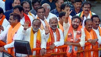 Hyderabad, Jun 21 (ANI): Union Minister of Coal and Mines G. Kishan Reddy, Union Minister of State for Home Affairs and Bharatiya Janata Party (BJP) National General Secretary Bandi Sanjay Kumar and others wave to the supporters during a roadshow after assuming charge as Ministers, in Hyderabad on Thursday. (ANI Photo) (Tharun Vinny ) Hyderabad, Jun 21 (ANI): Union Minister of Coal and Mines G. Kishan Reddy, Union Minister of State for Home Affairs and Bharatiya Janata Party (BJP) National General Secretary Bandi Sanjay Kumar and others wave to the supporters during a roadshow after assuming charge as Ministers, in Hyderabad on Thursday. (ANI Photo) (Tharun Vinny )