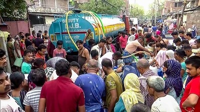 People gather near a water tanker to fill water as the water crisis continues in the National Capital, at Sanjay Colony, Okhla, in New Delhi on Saturday (ANI) People gather near a water tanker to fill water as the water crisis continues in the National Capital, at Sanjay Colony, Okhla, in New Delhi on Saturday (ANI)