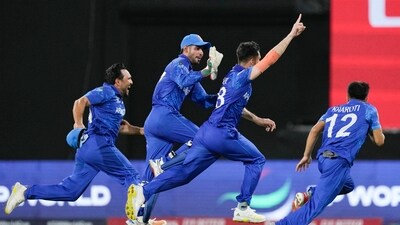 Afghanistan's Ibrahim Zadran, centre, reacts with teammates after taking the wicket of Bangladesh's Mustafizur Rahman to win by eight runs in their men's T20 World Cup cricket match at Arnos Vale Ground (AP) Afghanistan's Ibrahim Zadran, centre, reacts with teammates after taking the wicket of Bangladesh's Mustafizur Rahman to win by eight runs in their men's T20 World Cup cricket match at Arnos Vale Ground (AP)