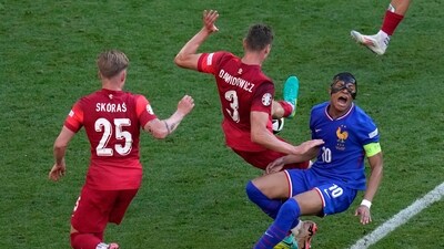 Kylian Mbappe of France falls with Poland's Pawel Dawidowicz during a Group D match (AP) Kylian Mbappe of France falls with Poland's Pawel Dawidowicz during a Group D match (AP)