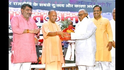 CM Yogi Adityanath felicitates Sheetal Pandey and others for their sacrifices to save democracy at a seminar at Baba Gambhir Nath Auditorium in Gorakhpur on Tuesday. (Sourced) CM Yogi Adityanath felicitates Sheetal Pandey and others for their sacrifices to save democracy at a seminar at Baba Gambhir Nath Auditorium in Gorakhpur on Tuesday. (Sourced)