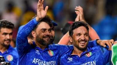Afghanistan's captain Rashid Khan with teammate Gulbadin Naib (PTI) Afghanistan's captain Rashid Khan with teammate Gulbadin Naib (PTI)