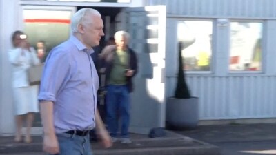 WikiLeaks founder Julian Assange walks to board a plane at a location given as London, Britain, in this still image from video released JUNE 25, 2024. (@wikileaks)