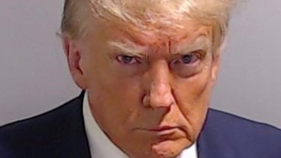 Donald Trump turned himself in to the Fulton County Jail last August as required by the terms of his criminal indictment in Georgia. (via Reuters)