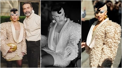 Doja Cat took inspiration from Breakfast at Tiffany's and gave it a modern twist for her appearance at the Schiaparelli show. The rapper arrived at the haute couture show in a cream-coloured voluminous blazer while carrying a golden cigarette holder in her hands. (Instagram) Doja Cat took inspiration from Breakfast at Tiffany's and gave it a modern twist for her appearance at the Schiaparelli show. The rapper arrived at the haute couture show in a cream-coloured voluminous blazer while carrying a golden cigarette holder in her hands. (Instagram)