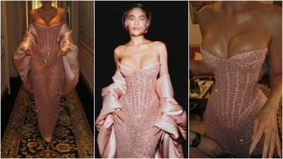 Kylie paired the sheer Schiaparelli gown with matching blush pink thigh-high stockings and a subtle see-through veil covering her face. Apart from blush pink heels embellished with crystals, Kylie skipped accessories to allow her ensemble to shine independently. (Instagram) Kylie paired the sheer Schiaparelli gown with matching blush pink thigh-high stockings and a subtle see-through veil covering her face. Apart from blush pink heels embellished with crystals, Kylie skipped accessories to allow her ensemble to shine independently. (Instagram)