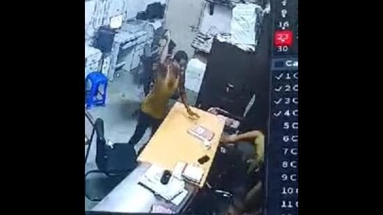 A CCTV grab showing the sword-wielding man attacking the head constable on duty at the Moti Nagar police station in Ludhiana on Monday night.