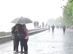 People at Marine drive enjoying the rains, Mumbai has been experiencing the onset of southwest monsoon and gusty winds as well (ANI Photo)