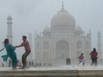 Agra: Tourists enjoy during rains, at the Taj Mahal, in Agra, Wednesday, June 26, 2024. (PTI Photo) Agra: Tourists enjoy during rains, at the Taj Mahal, in Agra, Wednesday, June 26, 2024. (PTI Photo)