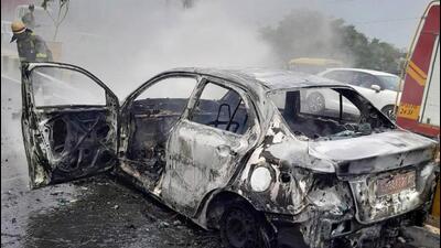 A fire tender was used to douse the fire on Wednesday. But the car was completely gutted, said the fire brigade. (HT Photo) A fire tender was used to douse the fire on Wednesday. But the car was completely gutted, said the fire brigade. (HT Photo)