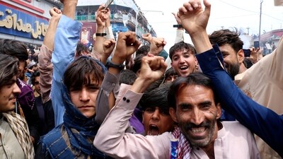 Afghan cricket fans celebrate their team's victory during the men's T20 World Cup cricket match between Afghanistan and Bangladesh, in the city of Khost province eastern of Afghanistan, Tuesday, June. 25, 2024. (AP Photo/Saifullah Zahir) (AP) Afghan cricket fans celebrate their team's victory during the men's T20 World Cup cricket match between Afghanistan and Bangladesh, in the city of Khost province eastern of Afghanistan, Tuesday, June. 25, 2024. (AP Photo/Saifullah Zahir) (AP)