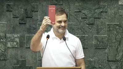 Congress MP Rahul Gandhi shows a copy of the Constitution while taking oath as a member of the 18th Lok Sabha on Tuesday. (PTI Photo) Congress MP Rahul Gandhi shows a copy of the Constitution while taking oath as a member of the 18th Lok Sabha on Tuesday. (PTI Photo)