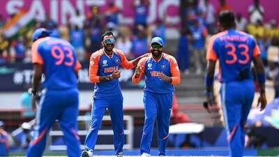 India's Axar Patel (2nd L) and India's captain Rohit Sharma (2nd R) celebrate after dismissing Australia's Marcus Stoinis (AFP) India's Axar Patel (2nd L) and India's captain Rohit Sharma (2nd R) celebrate after dismissing Australia's Marcus Stoinis (AFP)