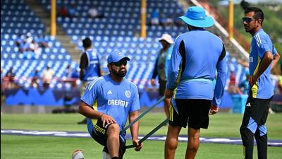 India's Yuzvendra Chahal (R) and India's captain Rohit Sharma (L) practice prior the ICC men's Twenty20 World Cup 2024 Super Eight cricket match between Australia and India at Daren Sammy National Cricket Stadium in Gros Islet, Saint Lucia on June 24, 2024. (Photo by CHANDAN KHANNA / AFP) (AFP)