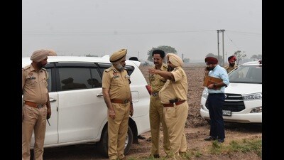 Police officials at the crime scene at Chattar Nagar village in Patiala district on Wednesday. (HT Photo) Police officials at the crime scene at Chattar Nagar village in Patiala district on Wednesday. (HT Photo)