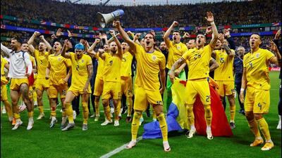 Romania's Ianis Hagi and teammates celebrate with their fans after the match. (REUTERS) Romania's Ianis Hagi and teammates celebrate with their fans after the match. (REUTERS)