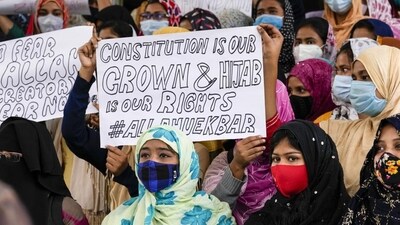 Petitioners cited certain verses from the Quran before the HC to support their claim that wearing hijab was an essential part of Islam. (Representative image) (AP) Petitioners cited certain verses from the Quran before the HC to support their claim that wearing hijab was an essential part of Islam. (Representative image) (AP)