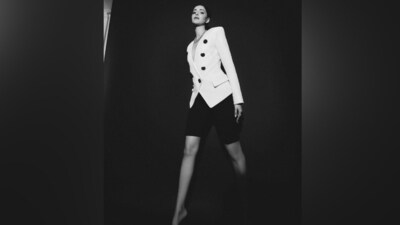 Ananya shared the pictures of her black and white outfit on Instagram. The ensemble is from Balmain and can become your go-to business look for summer. The white blazer features padded shoulders, full-length sleeves, a deep V neckline, double-breasted front closure, metal rose-shaped button embellishments, an asymmetric hem, and a tailored fitting. (Instagram) Ananya shared the pictures of her black and white outfit on Instagram. The ensemble is from Balmain and can become your go-to business look for summer. The white blazer features padded shoulders, full-length sleeves, a deep V neckline, double-breasted front closure, metal rose-shaped button embellishments, an asymmetric hem, and a tailored fitting. (Instagram)