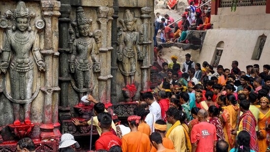 Devotees throng Kamakhya temple to offer prayers after the doors of the temple re-open for devotees after the four day Ambubachi Mela, in Guwahati on Wednesday. Kamakhya Temple reopens after Ambubachi Mela, devotees throng sacred Shakti cult shrine (ANI Photo/Pitamber Newar)