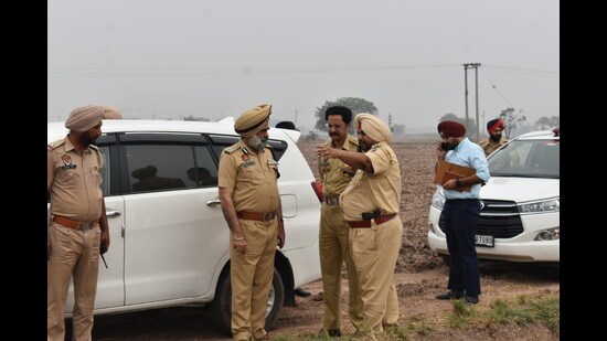 Police officials at the crime scene at Chattar Nagar village in Patiala district on Wednesday. (HT Photo)