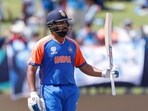 India's captain Rohit Sharma celebrates his half-century during the semi-final match against England 