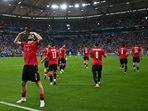 Georgia's forward Khvicha Kvaratskhelia celebrates scoring his team's goal.