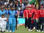 India's Captain Rohit Sharma (L) and England's Captain Jos Buttler (R) escort their respective teams in T20 World Cup semi-final