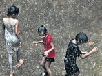 Mumbai, India. June 21, 2024: Children are playing during rain in the Sion area of Mumbai on Friday. June 21, 2024. (Photo by Raju Shinde/HT Photo)