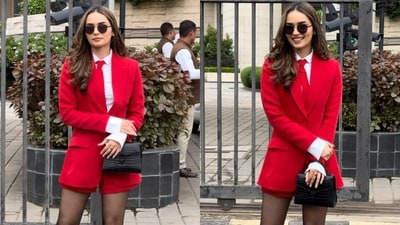 Manushi Chhillar's latest look offers a refreshing alternative to traditional formal wear, blending the sophistication of a red blazer with the comfort of matching shorts. Her chic outfit includes a cross-pleated white shirt and is accessorised with black round sunglasses, a handbag, and sheer stockings, setting new fashion goals. (Instagram) Manushi Chhillar's latest look offers a refreshing alternative to traditional formal wear, blending the sophistication of a red blazer with the comfort of matching shorts. Her chic outfit includes a cross-pleated white shirt and is accessorised with black round sunglasses, a handbag, and sheer stockings, setting new fashion goals. (Instagram)