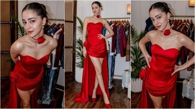 Ananya Pandey transforms into a red rose with her latest look, exuding sartorial elegance. Her outfit features an off-shoulder sweetheart neckline, a corset bodice, and a floor-touching train at the back, adorned with red flower embellishments that showcase high fashion. Paired with glamorous makeup, red pointy high heels and a clean bun, she completes her stylish ensemble. (Instagram) Ananya Pandey transforms into a red rose with her latest look, exuding sartorial elegance. Her outfit features an off-shoulder sweetheart neckline, a corset bodice, and a floor-touching train at the back, adorned with red flower embellishments that showcase high fashion. Paired with glamorous makeup, red pointy high heels and a clean bun, she completes her stylish ensemble. (Instagram)