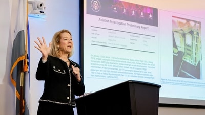 Elizabeth Lund, Senior Vice President, Quality at Boeing speaks to gathered media in front of a slide detailing the plug door blow-out that occurred on January 5, 2024, on Alaska Airlines flight 1282, at the Boeing 737 factory in Renton, Washington, U.S. June 25, 2024. (via REUTERS)
