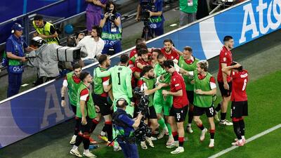 Georgia’s Georges Mikautadze celebrates with teammates after shooting from the penalty spot to score his team's second goal during Euro 2024 Group F match against Portugal in Gelsenkirchen on Wednesday. (AFP) Georgia’s Georges Mikautadze celebrates with teammates after shooting from the penalty spot to score his team's second goal during Euro 2024 Group F match against Portugal in Gelsenkirchen on Wednesday. (AFP)