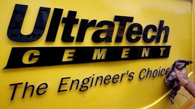A man cleans an Expert Testing Van of UltraTech Cement outside a cement store in Ahmedabad. (Amit Dave/Reuters)