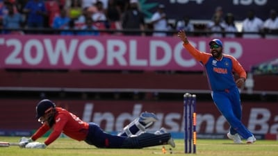 India's captain Rohit Sharma, right, celebrates the run-out of England's Adil Rashid (PTI) India's captain Rohit Sharma, right, celebrates the run-out of England's Adil Rashid (PTI)