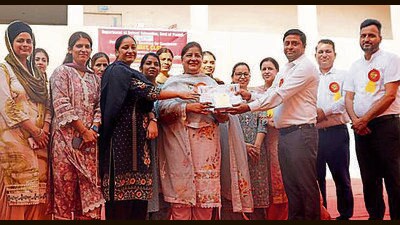 School education special secretary Churchil Kumar honours teachers of meritorious school in Ludhiana on Thursday. (Manish/HT)
