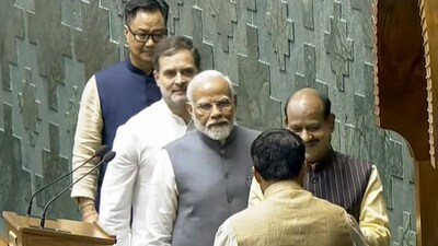 Prime Minister Narendra Modi, Leader of the Opposition Rahul Gandhi and Union Minister for Parliamentary Affairs Kiren Rijiju escort Om Birla to the chair after the latter was elected as the Speaker of the House during the first session of the 18th Lok Sabha, (PTI) Prime Minister Narendra Modi, Leader of the Opposition Rahul Gandhi and Union Minister for Parliamentary Affairs Kiren Rijiju escort Om Birla to the chair after the latter was elected as the Speaker of the House during the first session of the 18th Lok Sabha, (PTI)