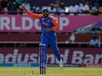 India's captain Rohit Sharma celebrates the run-out of England's Adil Rashid during the ICC Men's T20 World Cup second semifinal cricket match