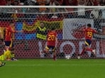 Spain celebrate after Italy's own goal.