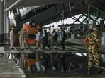 Policemen walk past the collapsed terminal roof of New Delhi's international airport after heavy rains in New Delhi on June 28, 2024. The roof of a terminal building at New Delhi's international airport partially collapsed in heavy rains early June 28, killing one person, rescuers said, months after a refurbishment project was inaugurated by Prime Minister Narendra Modi. (Photo by Arun SANKAR / AFP)