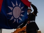 A honor guard takes part in a flag lowering ceremony at Chiang Kai Shek Memorial Hall in Taipei, Taiwan A honor guard takes part in a flag lowering ceremony at Chiang Kai Shek Memorial Hall in Taipei, Taiwan