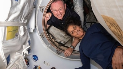 In this photo provided by NASA, Boeing Crew Flight Test astronauts Butch Wilmore, left, and Suni Williams pose for a portrait inside the vestibule between the forward port on the International Space Station's Harmony module and Boeing's Starliner spacecraft on June 13, 2024. (NASA via AP) (AP) In this photo provided by NASA, Boeing Crew Flight Test astronauts Butch Wilmore, left, and Suni Williams pose for a portrait inside the vestibule between the forward port on the International Space Station's Harmony module and Boeing's Starliner spacecraft on June 13, 2024. (NASA via AP) (AP)