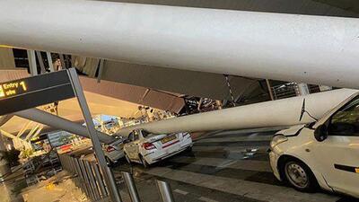 Crushed vehicles under a portion of a collapsed roof at the Delhi airport's Terminal 1 on Friday. (PTI Photo)