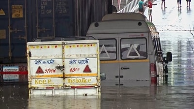 Vehicles partially submerged in the waterlogged underpass at Moolchand following heavy rainfall, in New Delhi on Friday. (ANI) Vehicles partially submerged in the waterlogged underpass at Moolchand following heavy rainfall, in New Delhi on Friday. (ANI)