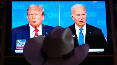 Roger Strassburg, of Scottsdale, Ariz., wears a cowboy hat as he watches the presidential debate between President Joe Biden and Republican presidential candidate former President Donald Trump at a debate watch party Thursday, June 27, 2024, in Scottsdale, Ariz. (AP Photo/Ross D. Franklin) (AP) Roger Strassburg, of Scottsdale, Ariz., wears a cowboy hat as he watches the presidential debate between President Joe Biden and Republican presidential candidate former President Donald Trump at a debate watch party Thursday, June 27, 2024, in Scottsdale, Ariz. (AP Photo/Ross D. Franklin) (AP)