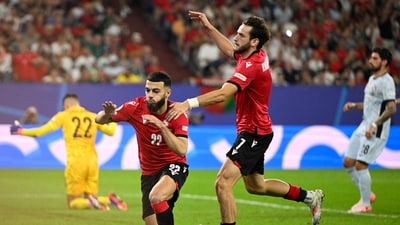 Georgia needed a miracle and they got it with a 2-0 win against Portugal, and it confirmed their qualification on Wednesday. (AFP) Georgia needed a miracle and they got it with a 2-0 win against Portugal, and it confirmed their qualification on Wednesday. (AFP)