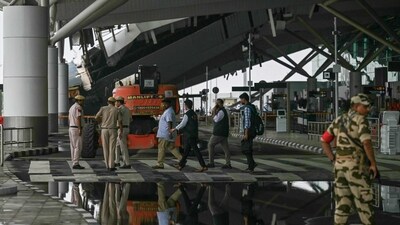 Policemen walk past the collapsed terminal roof of New Delhi's international airport after heavy rains in New Delhi on June 28, 2024. The roof of a terminal building at New Delhi's international airport partially collapsed in heavy rains early June 28, killing one person, rescuers said, months after a refurbishment project was inaugurated by Prime Minister Narendra Modi. (Photo by Arun SANKAR / AFP) (AFP) Policemen walk past the collapsed terminal roof of New Delhi's international airport after heavy rains in New Delhi on June 28, 2024. The roof of a terminal building at New Delhi's international airport partially collapsed in heavy rains early June 28, killing one person, rescuers said, months after a refurbishment project was inaugurated by Prime Minister Narendra Modi. (Photo by Arun SANKAR / AFP) (AFP)