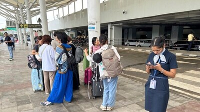 Delhi airport roof collapse: Passengers were seen waiting outside the Indira Gandhi International Airport in New Delhi. As a result of this incident, the spokesperson said all departures from Terminal 1 are temporarily suspended, and check-in counters are closed as a safety measure. (AP)