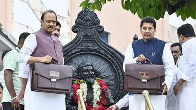 Mumbai, India - June 28, 2024: Dy CM & Finance minister Ajit Pawar along Deepak Keserkar shows budget bag before presenting the budget of 2024-2025, during monsoon session at Vidhan Bhavan, in Mumbai, India, on Friday, June 28, 2024. (Photo by Anshuman Poyrekar/ Hindustan Times) (Hindustan Times) Mumbai, India - June 28, 2024: Dy CM & Finance minister Ajit Pawar along Deepak Keserkar shows budget bag before presenting the budget of 2024-2025, during monsoon session at Vidhan Bhavan, in Mumbai, India, on Friday, June 28, 2024. (Photo by Anshuman Poyrekar/ Hindustan Times) (Hindustan Times)