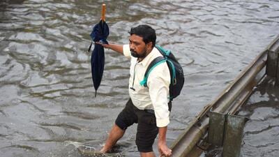 People are going to work amid rain on the NH-48 service road near Khandsa village in Gurugram on Friday. (Parveen Kumar/HT) People are going to work amid rain on the NH-48 service road near Khandsa village in Gurugram on Friday. (Parveen Kumar/HT)